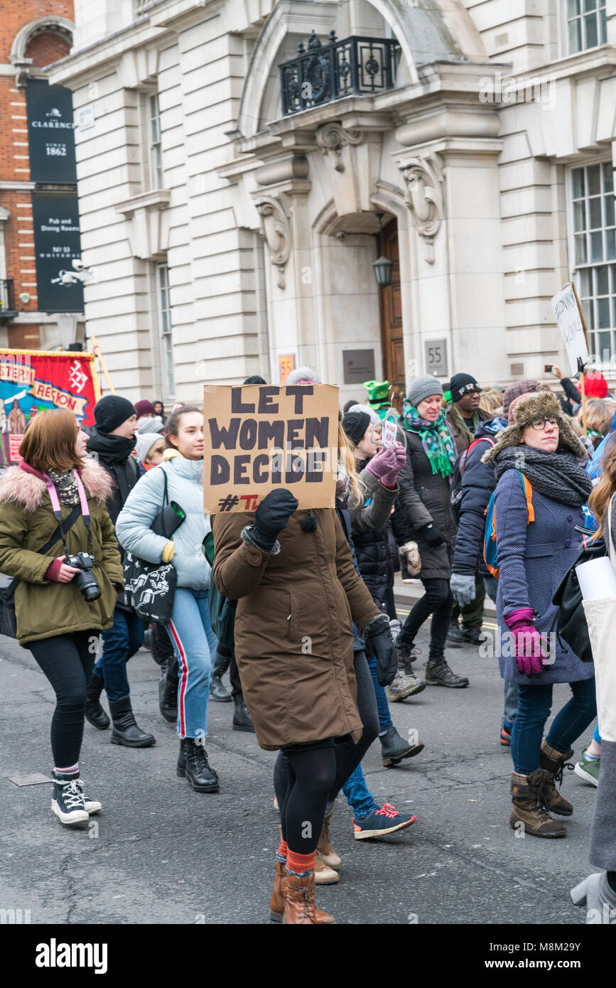 London, UK. 18 March 2018. Woman holding placard 'Let Women Decide' protesting against abortion rights in Ireland. St Patrick's parade in London. Credit: AndKa/Alamy Live News Stock Photo