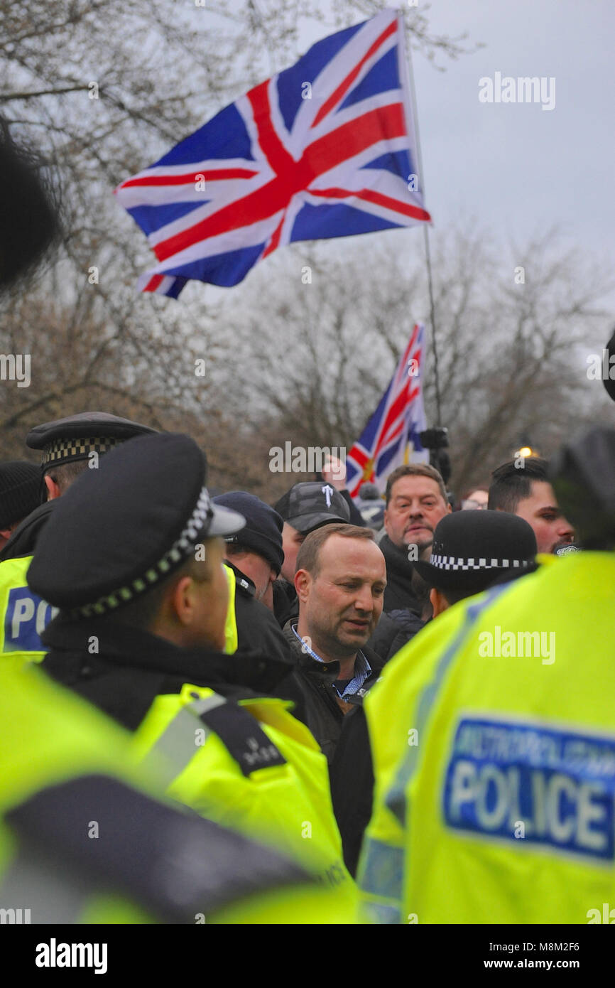 London, UK. 18th March, 2018. Nationalist demonstrators behind police lines at Speakers Corner prior to the arrival of Tommy Robinson (political activist and co-founder, former spokesman and leader of the English Defence League - EDL), Hyde Park, London, United Kingdom.    The corner was very densely packed with several hundred people which meant that it was virtually impossible for the vast majority of people to actually see him or hear what he was saying. Credit: Michael Preston/Alamy Live News Stock Photo