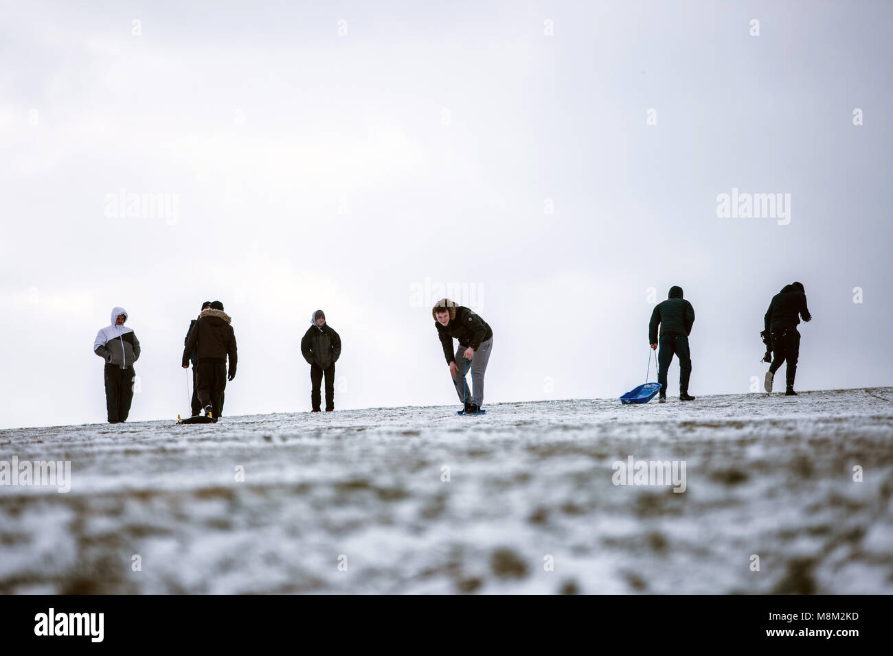 Leeds, Yorkshire, UK. 18th Mar, 2018. People seen using their sleds in the snow in Roundhay Park.Freezing weather conditions dubbed the 'Beast from the East' brings snow and sub-zero temperatures to the UK. Credit: Rahman Hassani/SOPA Images/ZUMA Wire/Alamy Live News Stock Photo