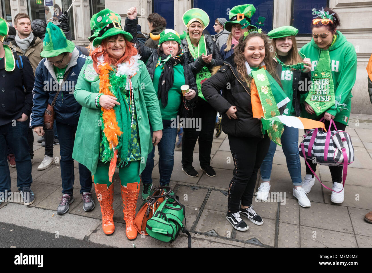 London, Britain. 18th Mar, 2018. Revellers watch the parade along Piccadilly to celebrate St. Patrick's Day in London, Britain, on March 18, 2018. Credit: Ray Tang/Xinhua/Alamy Live News Stock Photo