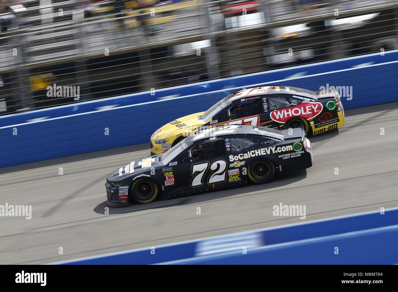 Fontana, California, USA. 18th Mar, 2018. Fontana, California, USA: Cole Whitt (72) and Matt DiBenedetto (32) battle for position during the Auto Club 400 at Auto Club Speedway in Fontana, California. (Credit Image: © Chris Owens Asp Inc/ASP via ZUMA Wire) /Alamy Live News Credit: ZUMA Press, Inc./Alamy Live News Stock Photo