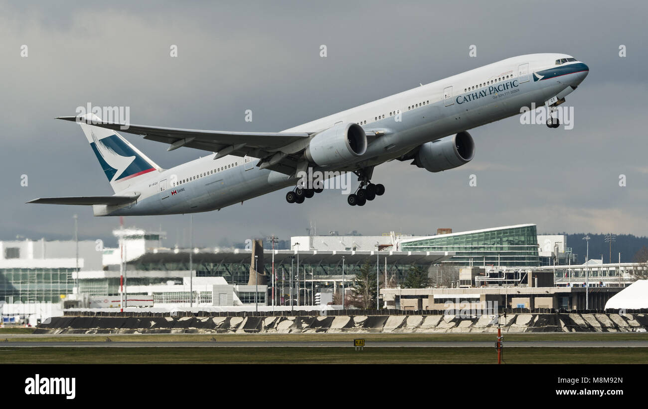 Richmond, British Columbia, Canada. 18th Mar, 2018. A Cathay Pacific Boeing 777-300ER (B-KQX) wide-body twin-engine jet airliner takes off from Vancouver International Airport. Cathay Pacific Airways is Hong Kong's flag carrier and part of Swire Pacific Ltd. Credit: Bayne Stanley/ZUMA Wire/Alamy Live News Stock Photo