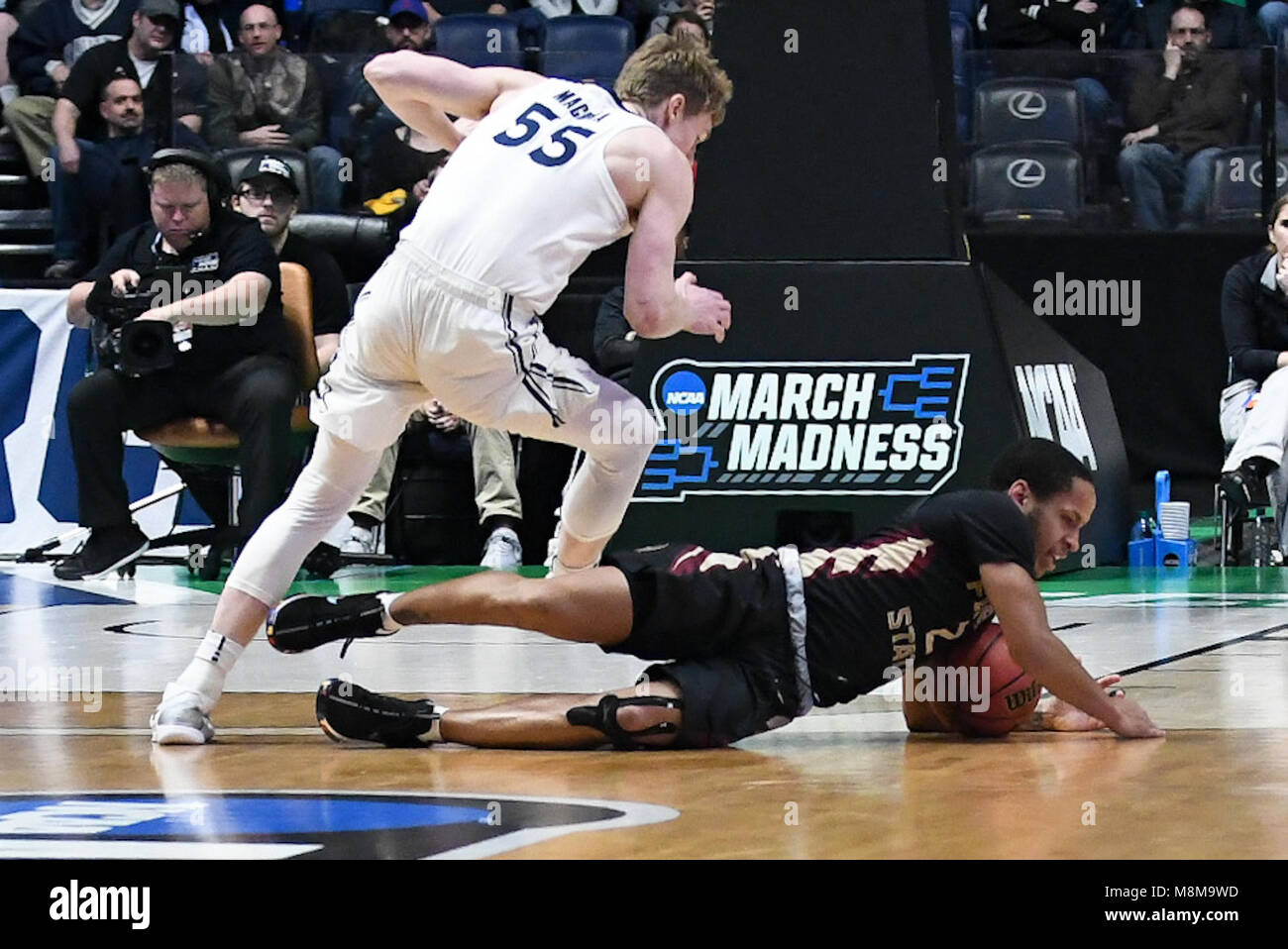 Nashville, Tennessee, USA. 18th Mar, 2018. Florida State Seminoles guard CJ Walker (2) and Xavier Musketeers guard J. P. Macura (55) battle for the ball at Bridgestone Arena on March 18, 2018 in Nashville, Tennessee. Credit: FGS Sports/Alamy Live News Stock Photo