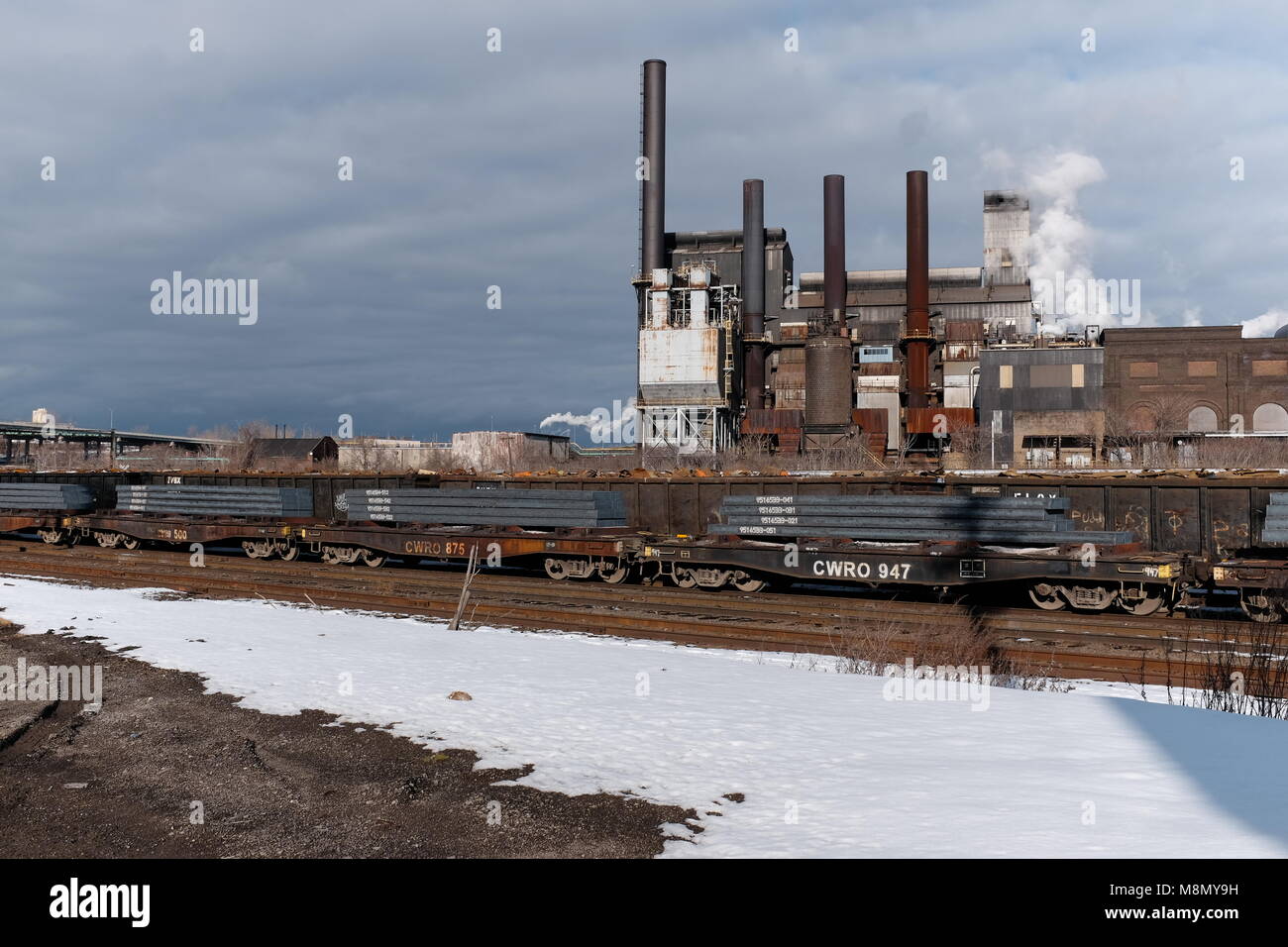 A functioning steelyard and factory in the midwest rust belt city of Cleveland, Ohio is shown on an overcast early March 2018 afternoon. Stock Photo