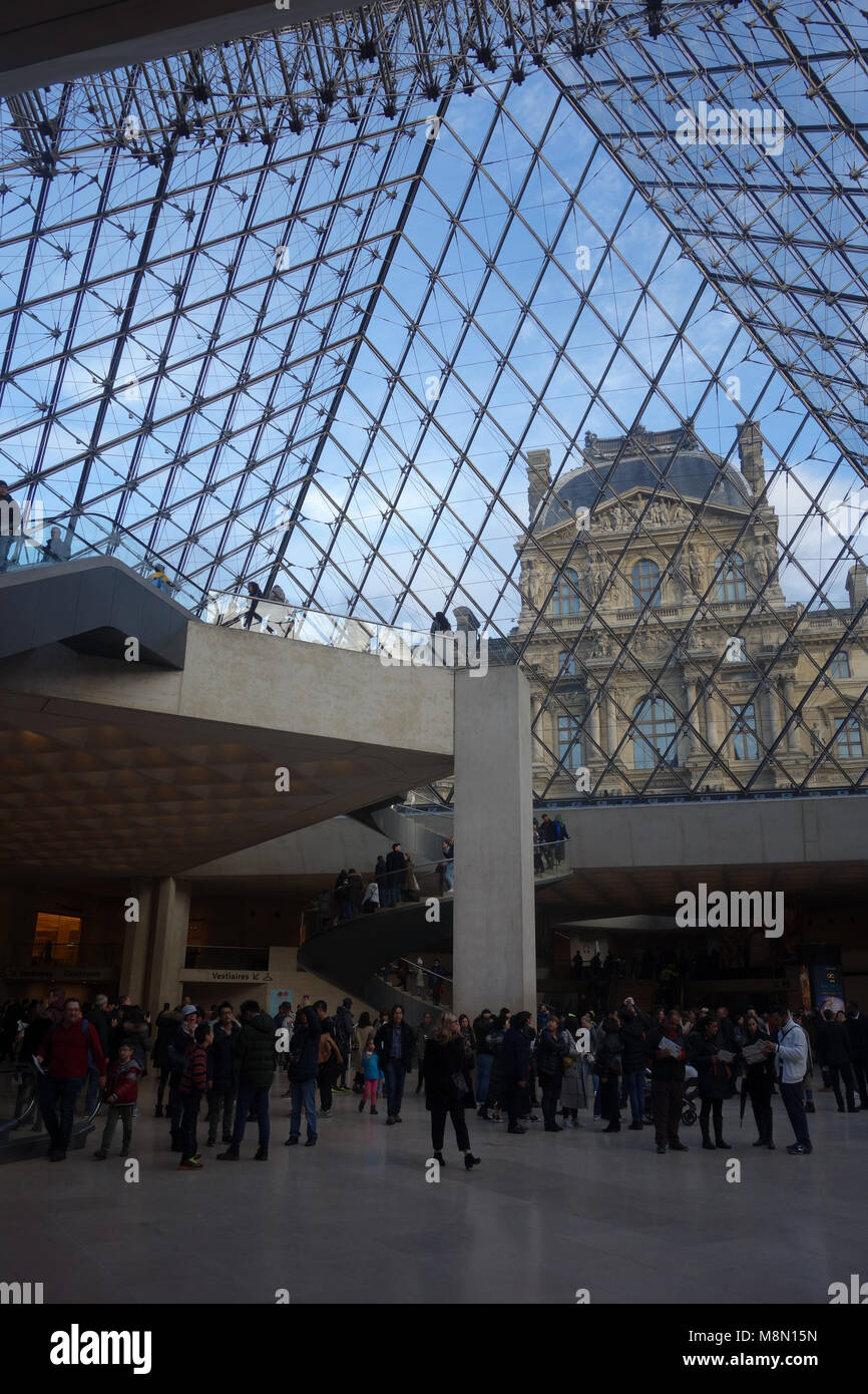 Dec 31, 2017 - Palais du Louvre seen through the Pyramid, Paris, France, Europe Stock Photo