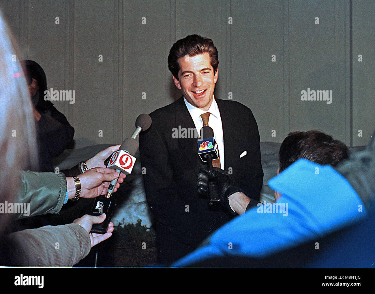 John F. Kennedy, Jr. speaks to reporters following his surprise, one