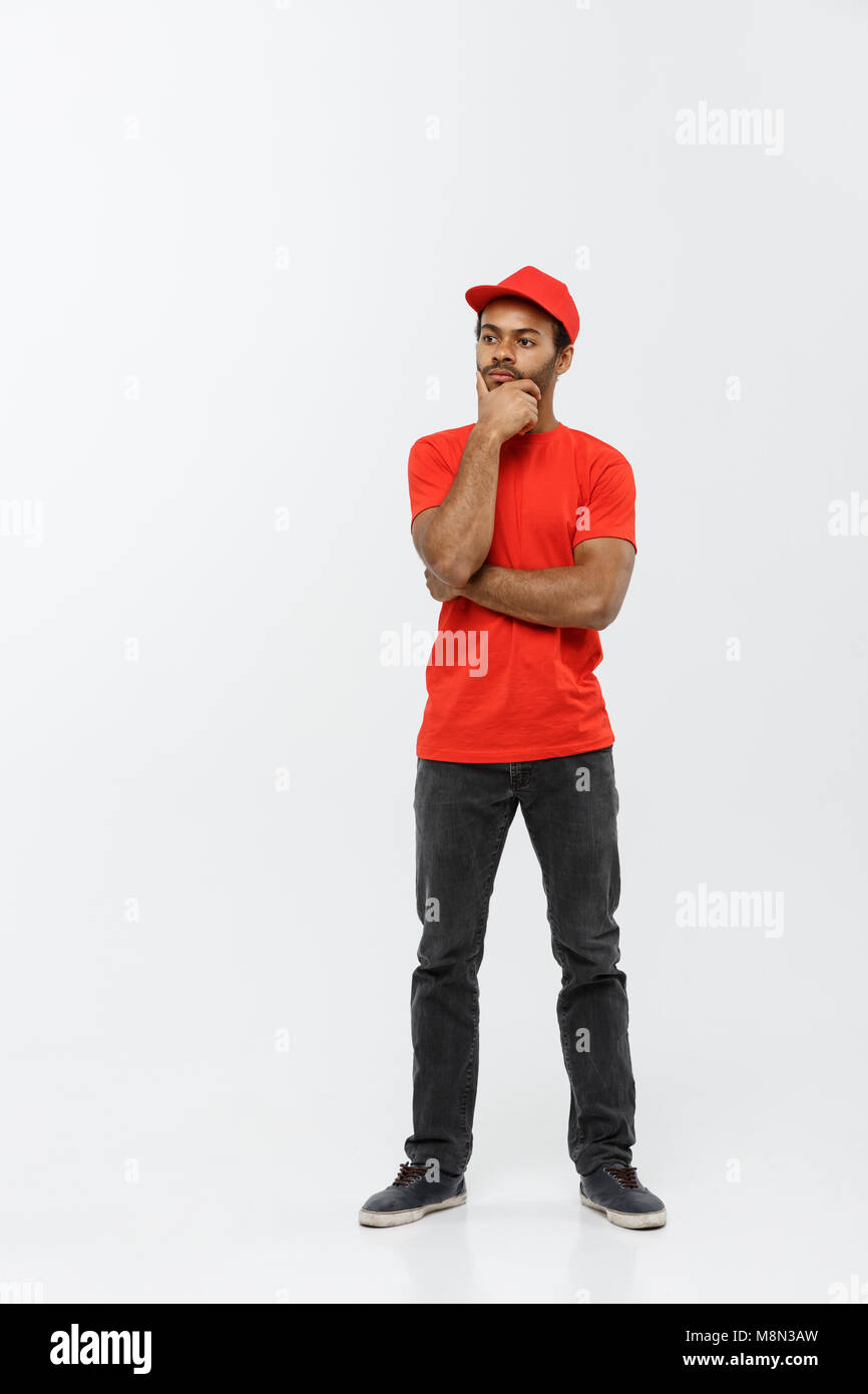 Delivery Concept Handsome African American delivery man serious thinking of something