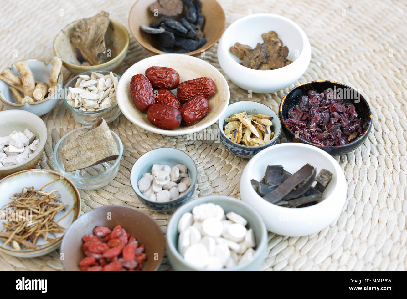 All kinds of Chinese herbal medicine in the porcelain cup Stock Photo