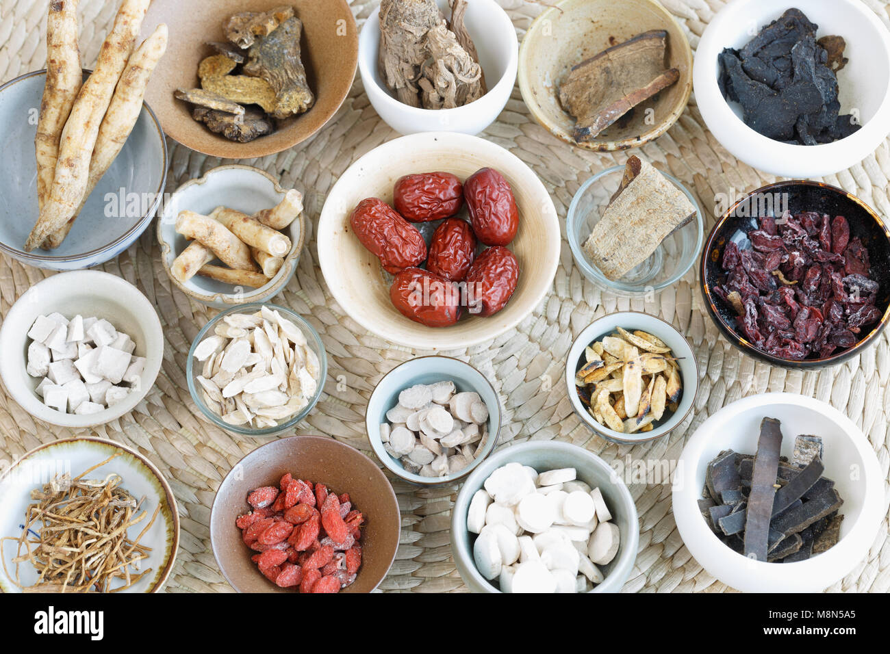 All kinds of Chinese herbal medicine in the porcelain cup Stock Photo