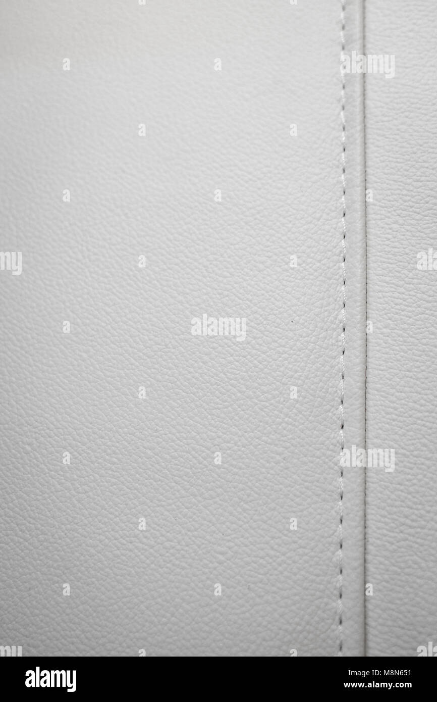 White leather texture with seams in close-up as a background Stock Photo