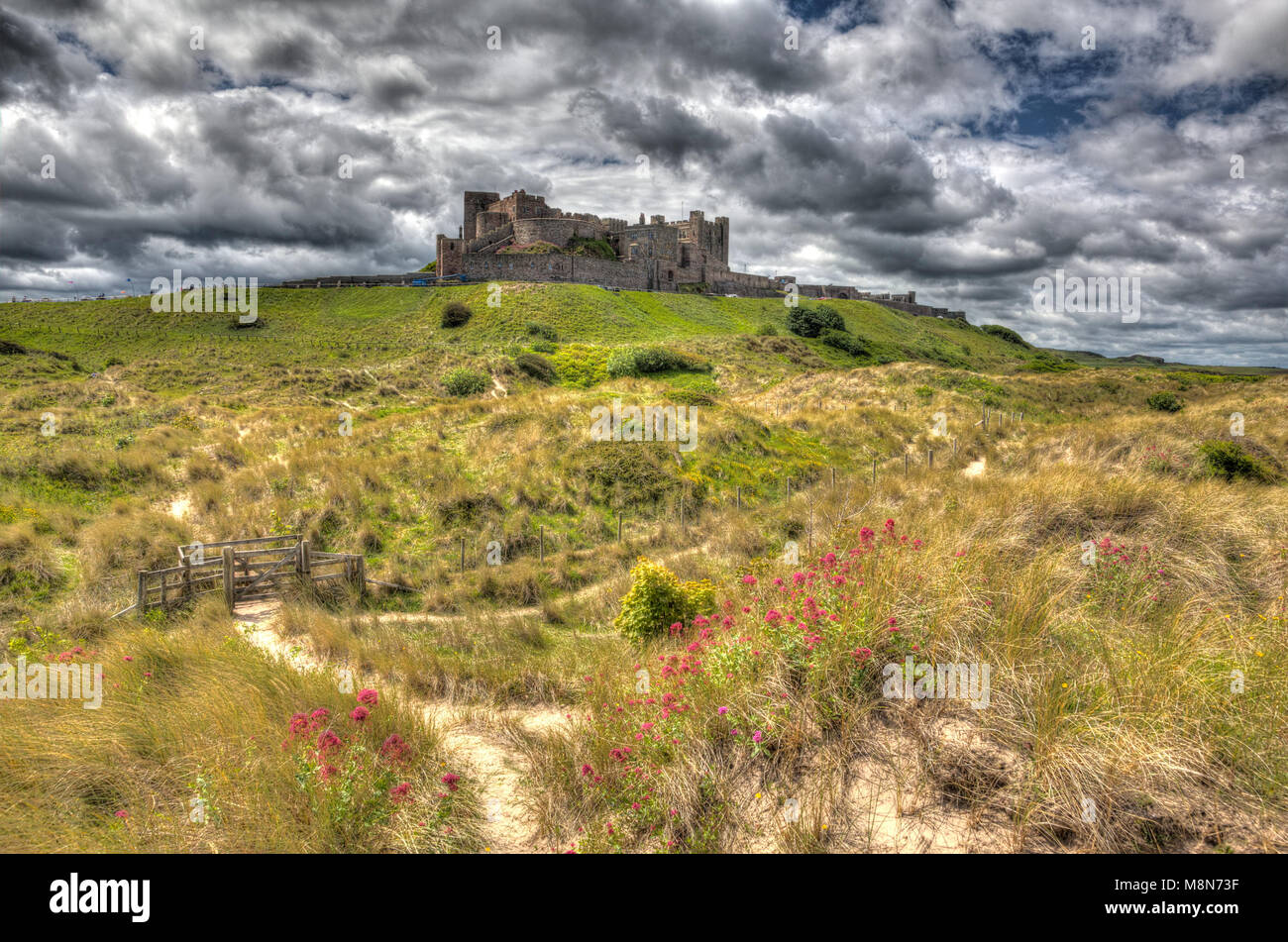 Bamburgh Castle Northumberland northern England medieval fortress on hill in hdr Stock Photo