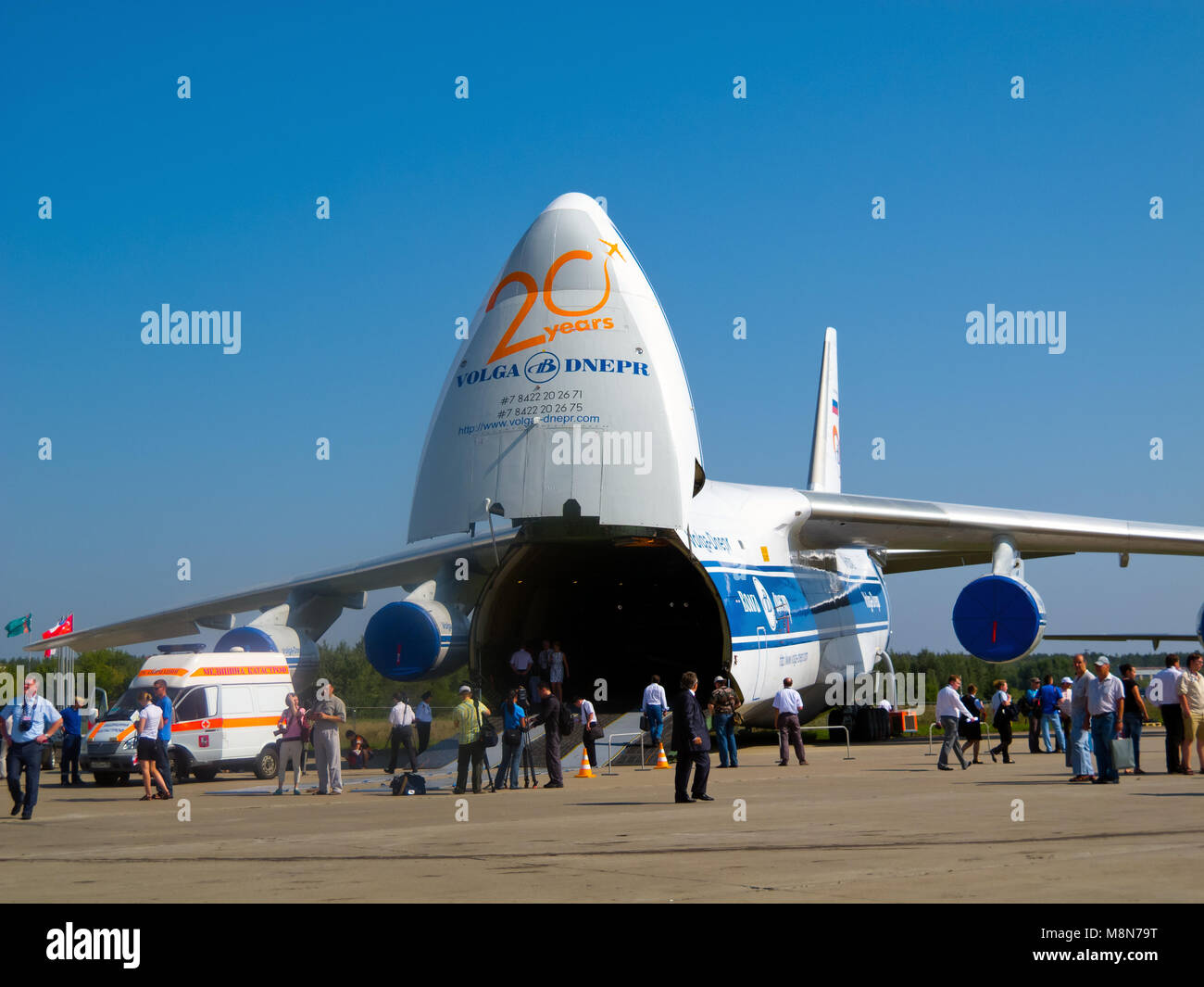 AN-124-100 strategic airlift jet (Condor), Antonov Volga-Dnepr unloading, front ramp down, nose door open. ZHUKOWSKY - AUGUST 17. Moscow Stock Photo