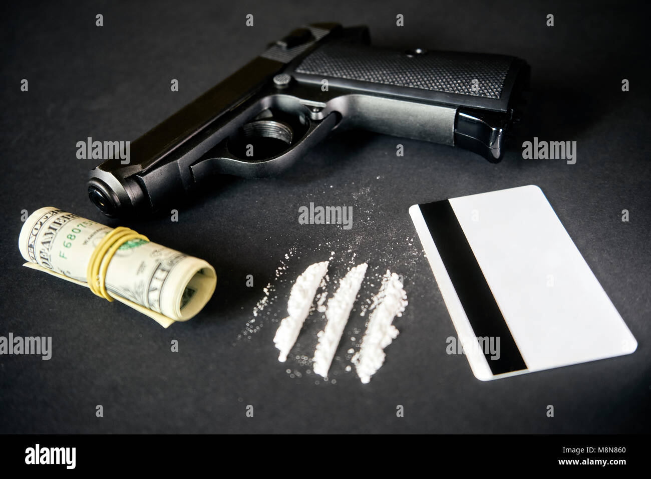 Drug Dealer gun, money, drug on black table Stock Photo Alamy