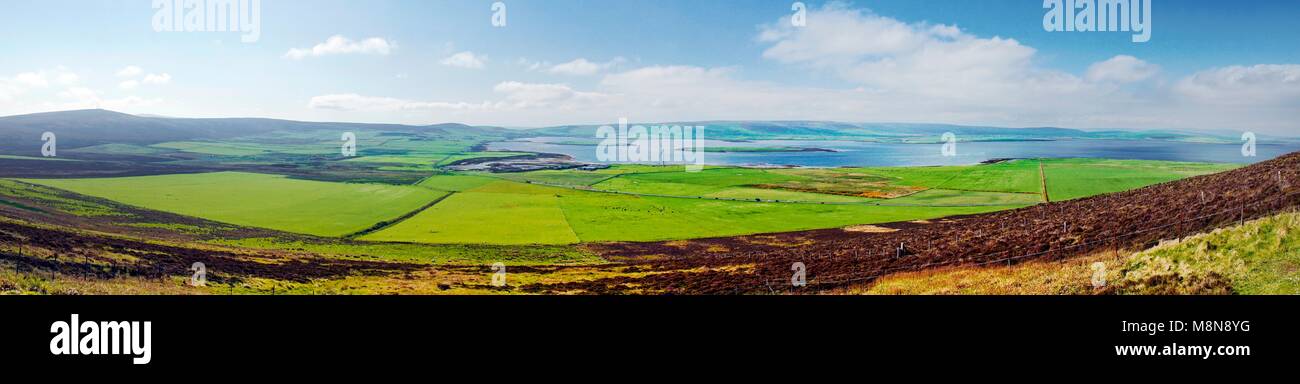 From Wideford Hill prehistoric chambered cairn west over Bay of Firth toward Finstown on island of Mainland, Orkney, Scotland. Panoramic view Stock Photo