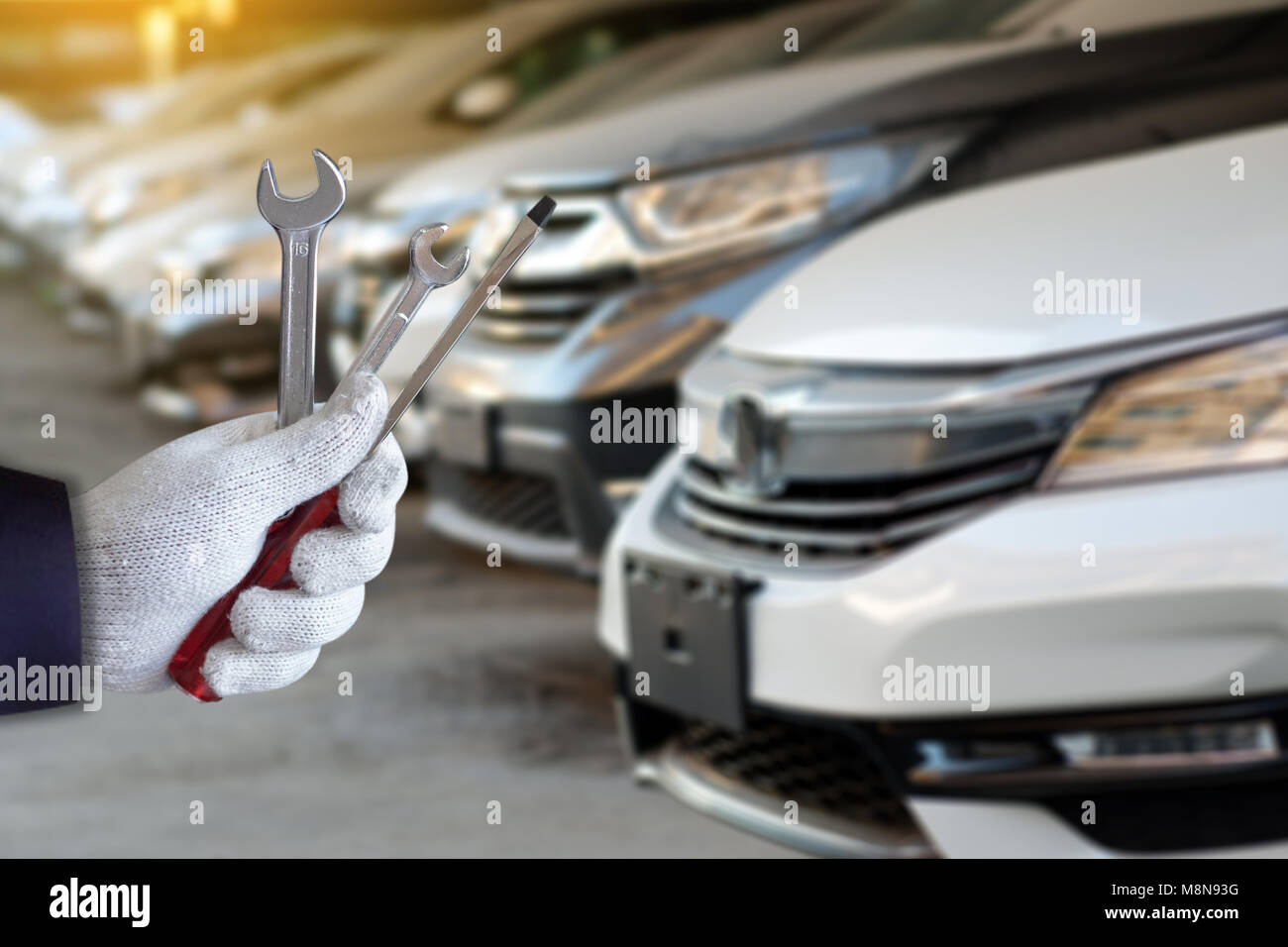 Mechanic repairing a car in garage Auto repair car engine Stock Photo ...