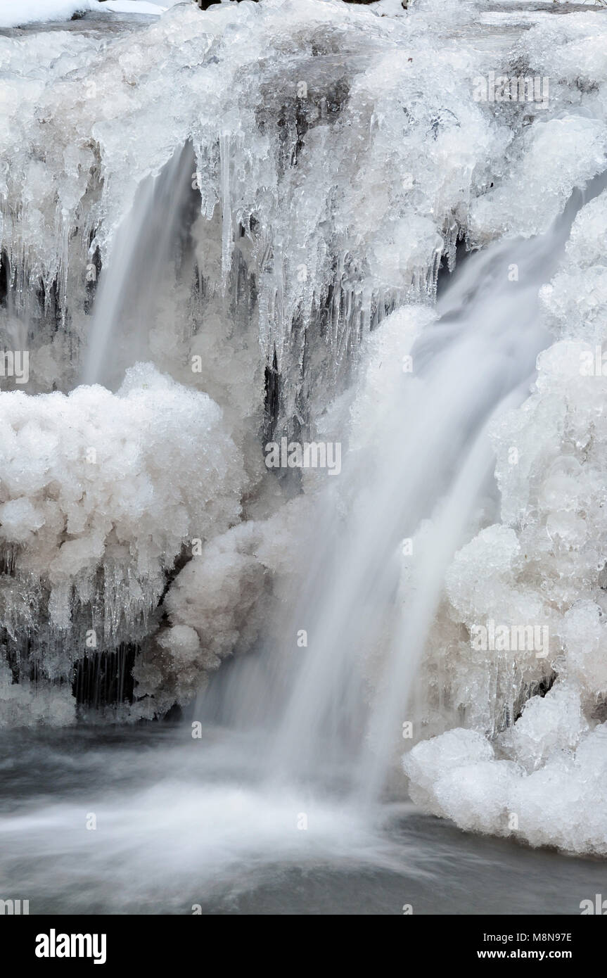 frozen river water beginning to melt Stock Photo Alamy