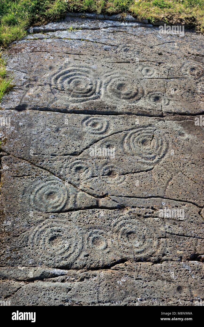 Cup and ring mark marks prehistoric Neolithic rock art on natural rock outcrop at Cairnbaan in Kilmartin Valley, Argyll, Scotland, UK Stock Photo
