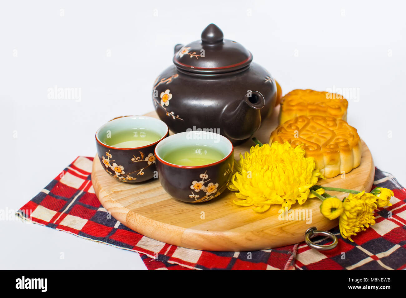 Moon cake and tea for Chinese mid autumn festival. Isolated on white. Copy space Stock Photo