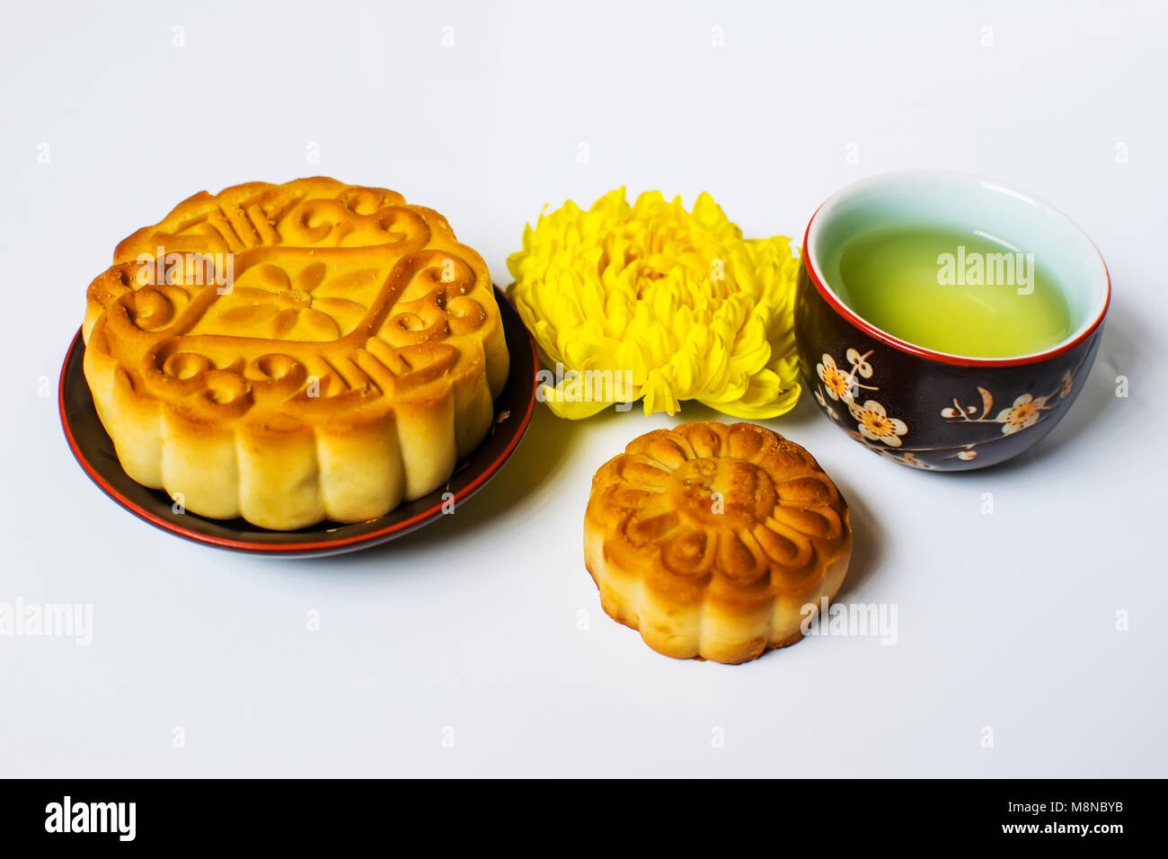 Moon cake and tea for Chinese mid autumn festival. Isolated on white. Copy space Stock Photo