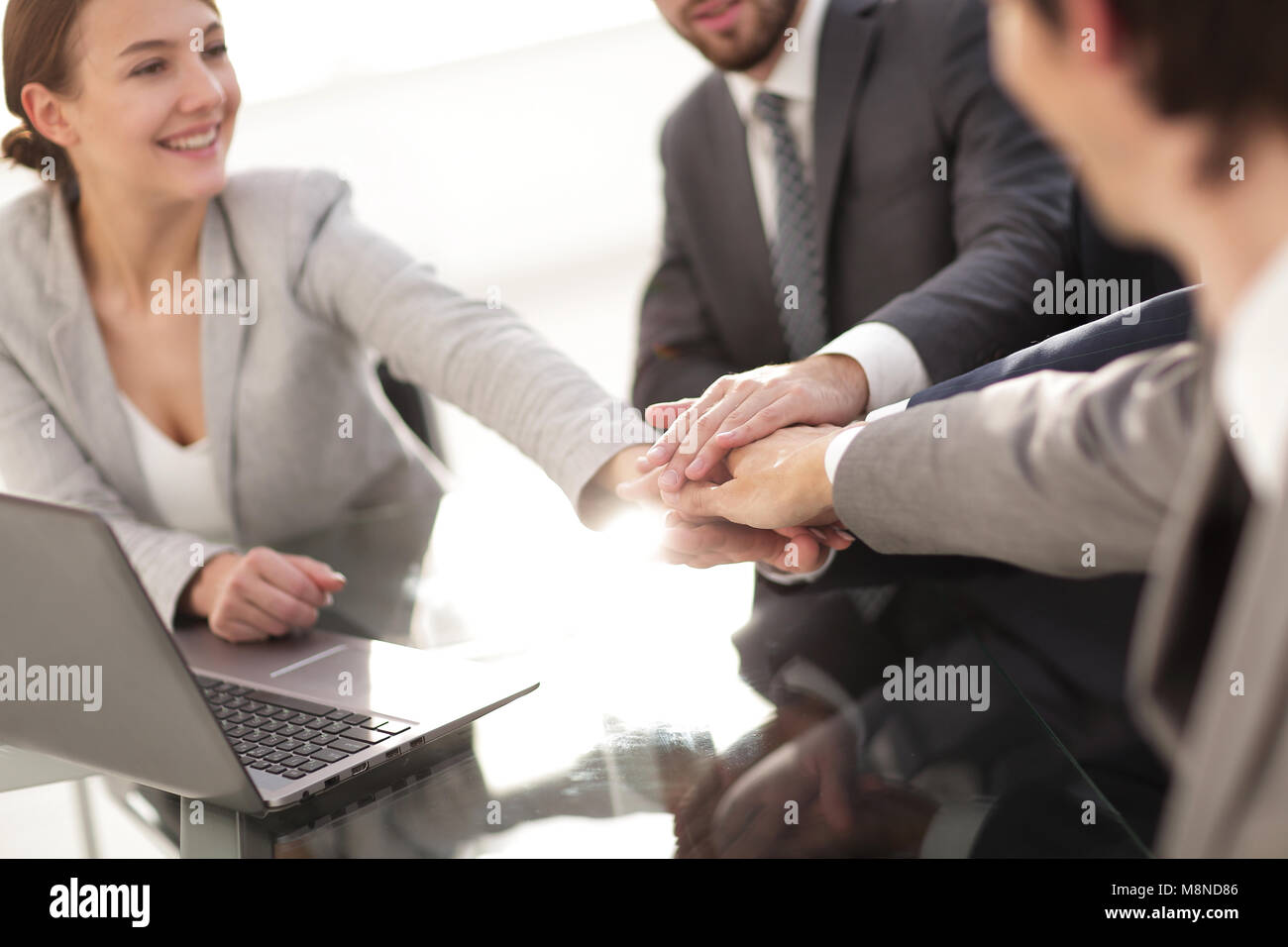 closeup. business team showing their unity Stock Photo - Alamy