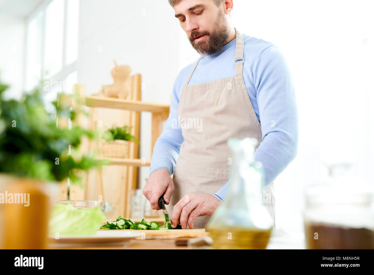 Husband Cooking at Home Stock Photo Alamy