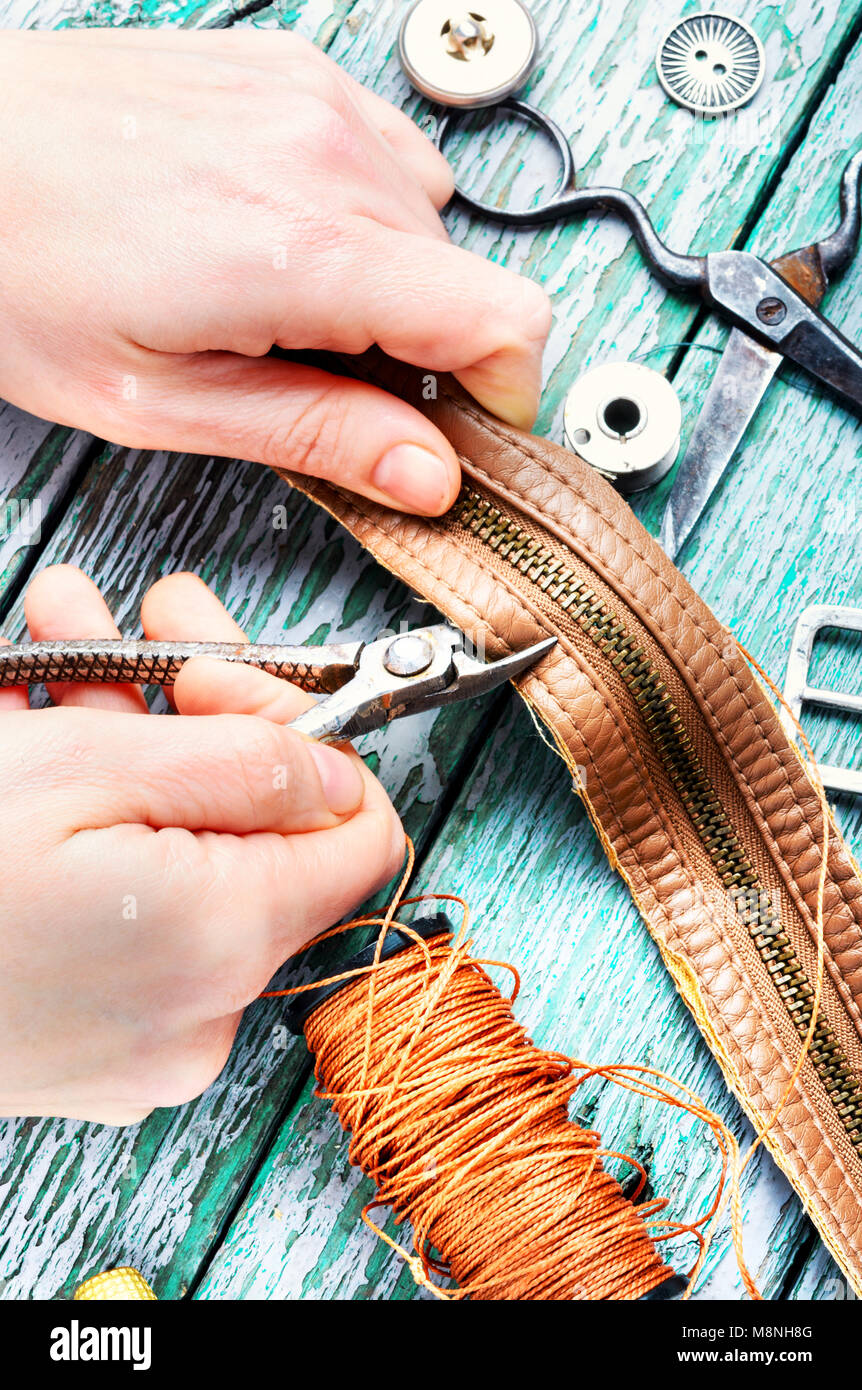 Tailor working with leather goods in retro style Stock Photo Alamy
