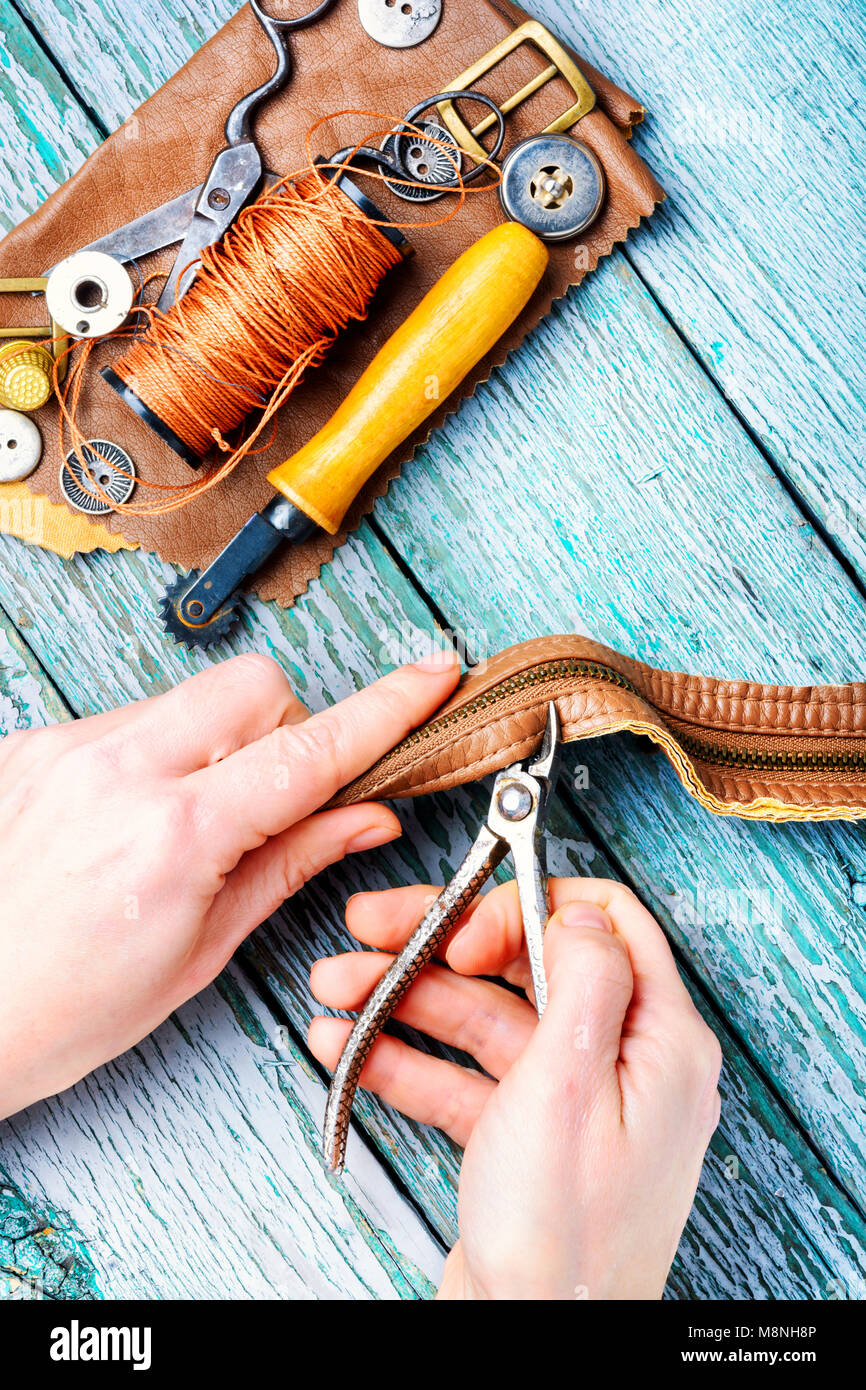 Tailor working with leather goods in retro style Stock Photo Alamy