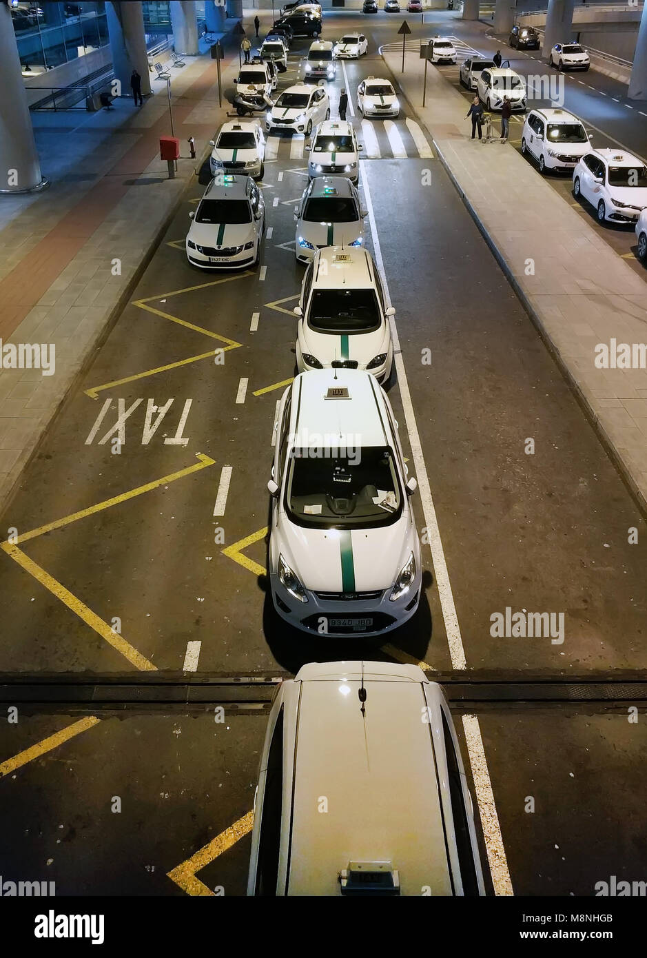 Alicante, Spain - March 15, 2018: Taxi cars waiting arrival passengers in the Alicante airport. Costa Blanca. Spain Stock Photo