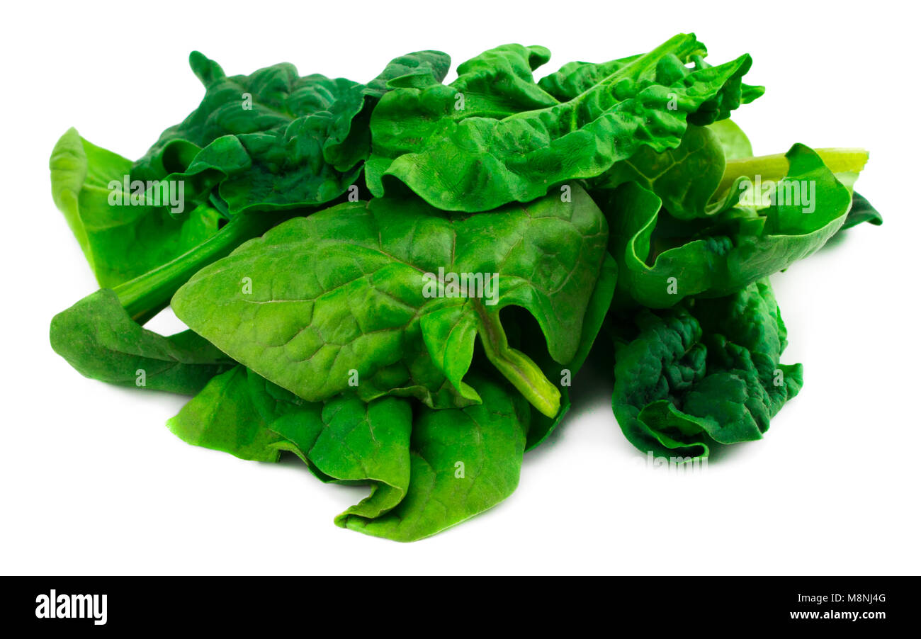 Green spinach leaves on isolated white background Stock Photo - Alamy