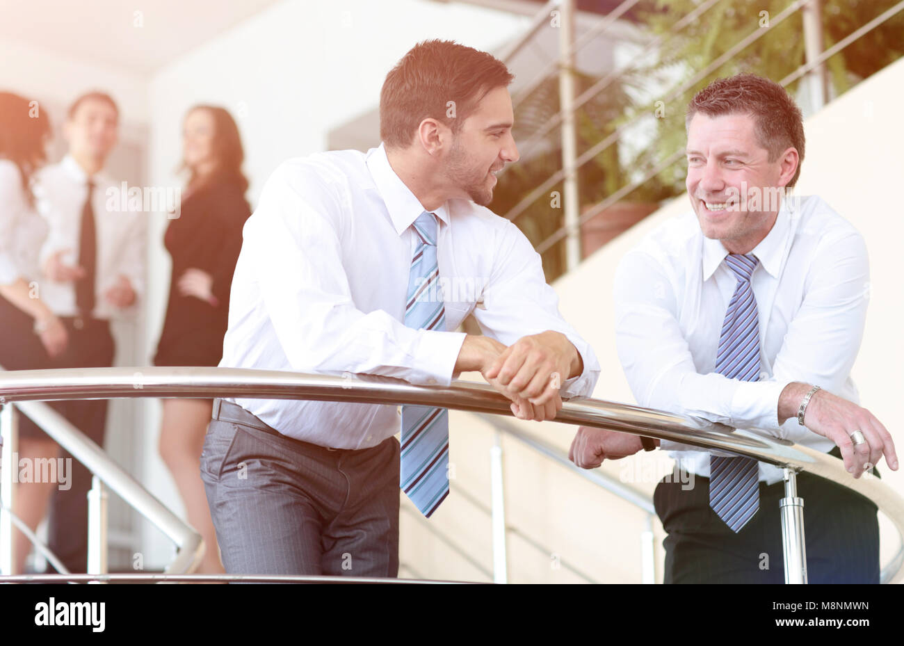 Happy successful business team working in office Stock Photo - Alamy