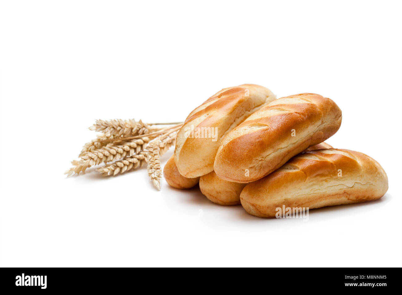Mini loaf bread and wheat ears isolated on white background Stock Photo ...