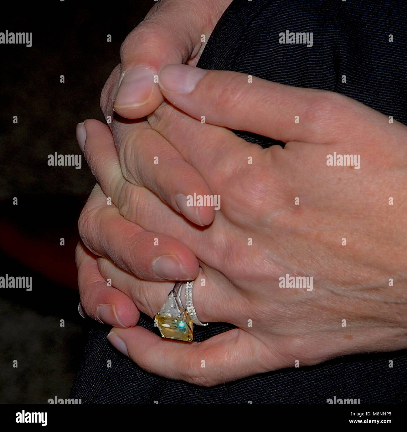Washington DC., USA, December 15, 2006 Sylvester Stallone holds his wife Jennifer Flavin's hand (with the large yellow diamond ring) at event where he  donates the boxing memorabilia from the 'Rocky' movies to the Smithsonian museum of American History. For the exhibit ''Treasures of the Smithsonian' Credit: Mark Reinstein/MediaPunch Stock Photo