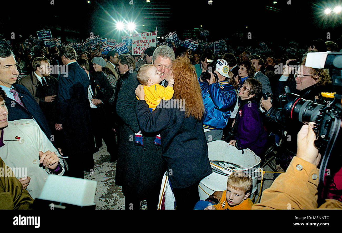 Ann Arbor, Michigan, USA, October 19, 1992 Presidential candidate Governor William Clinton arrives at the University of Michigan at Ann Arbor for the final debate with the incumbent President George H.W. Bush  and pauses to hold another baby. Credit: Mark Reinstein/MediaPunch Stock Photo