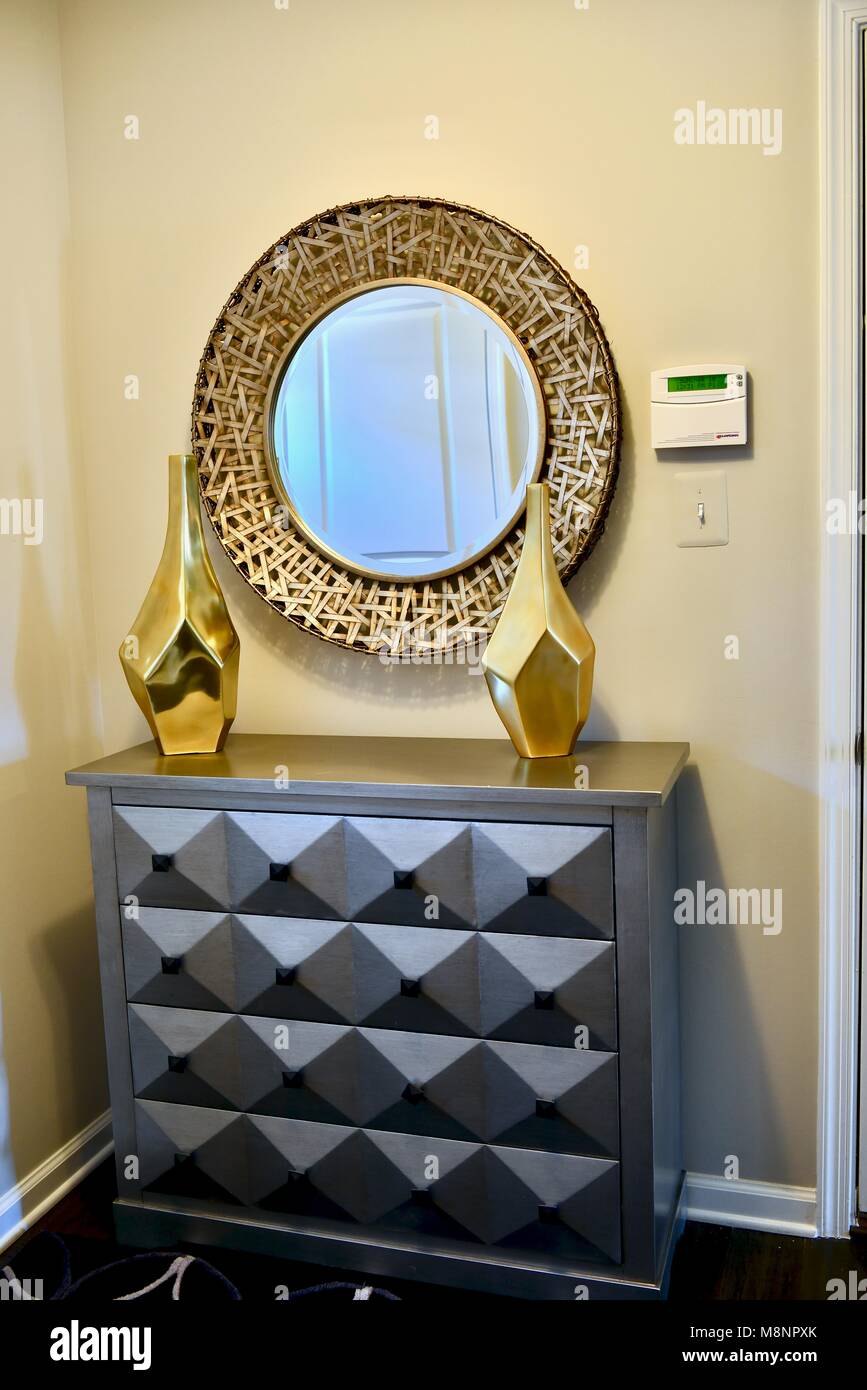 Modern dresser with gold accented furniture Stock Photo Alamy
