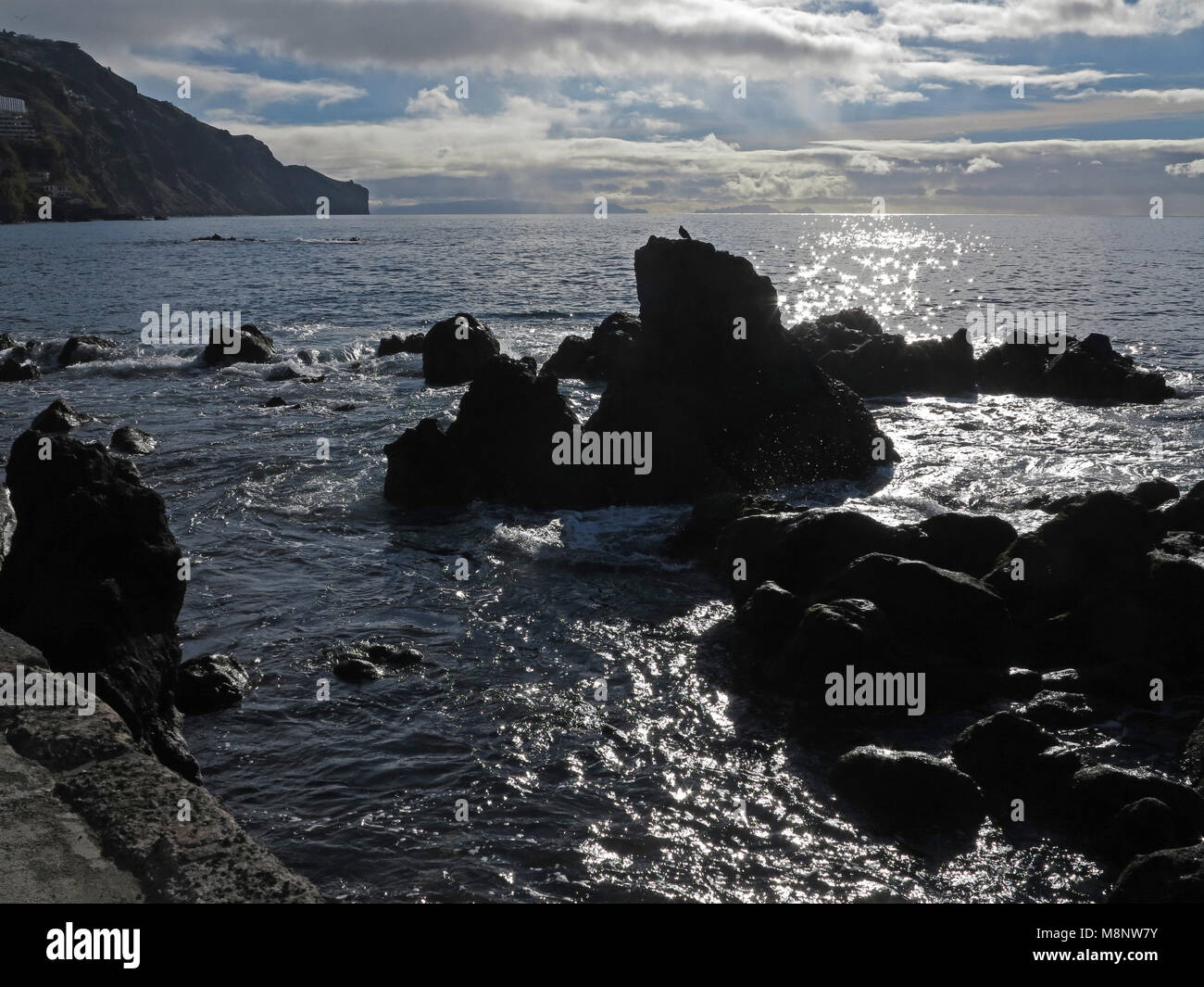 Curiously shaped rocks in the Atlantic near the seaside promenade of ...