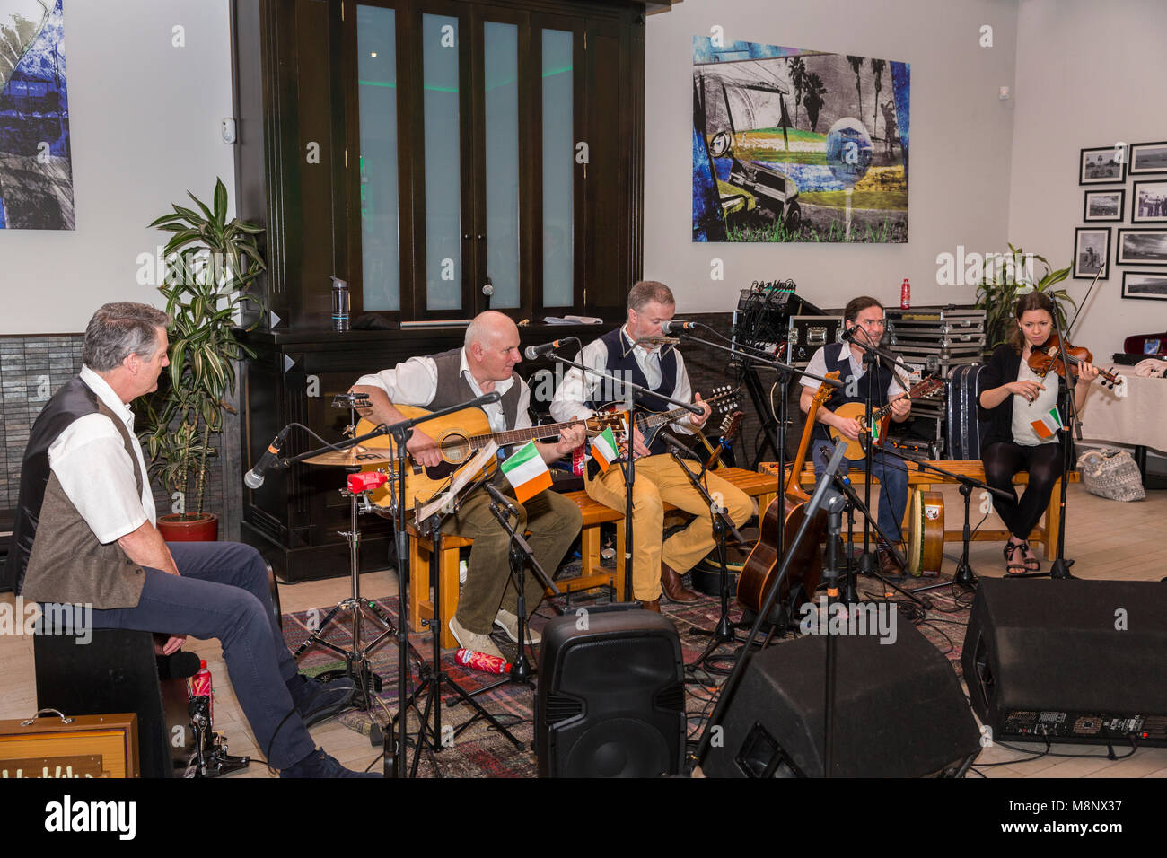 Group of traditional Irish musicians playing a gig at a Saint Patricks day celebration dinner in the Adeje golf clubhouse, Tenerife, Canary Islands, S Stock Photo