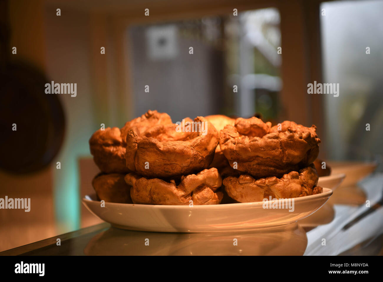 food of cooked golden Yorkshire puddings in a bowl Stock Photo