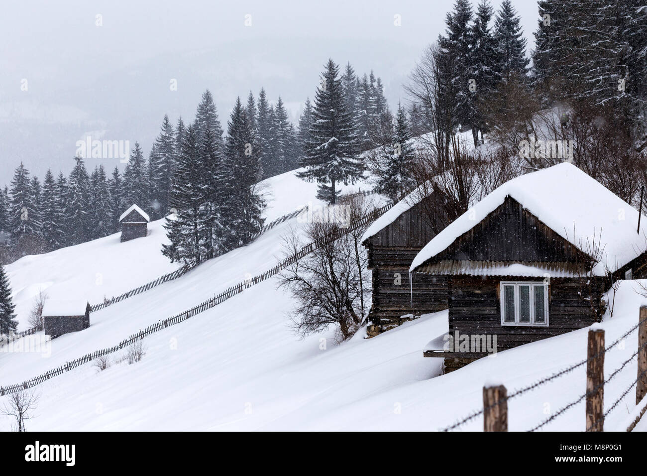 Old wooden houses in a mountain village in Romania Carpathians Stock ...