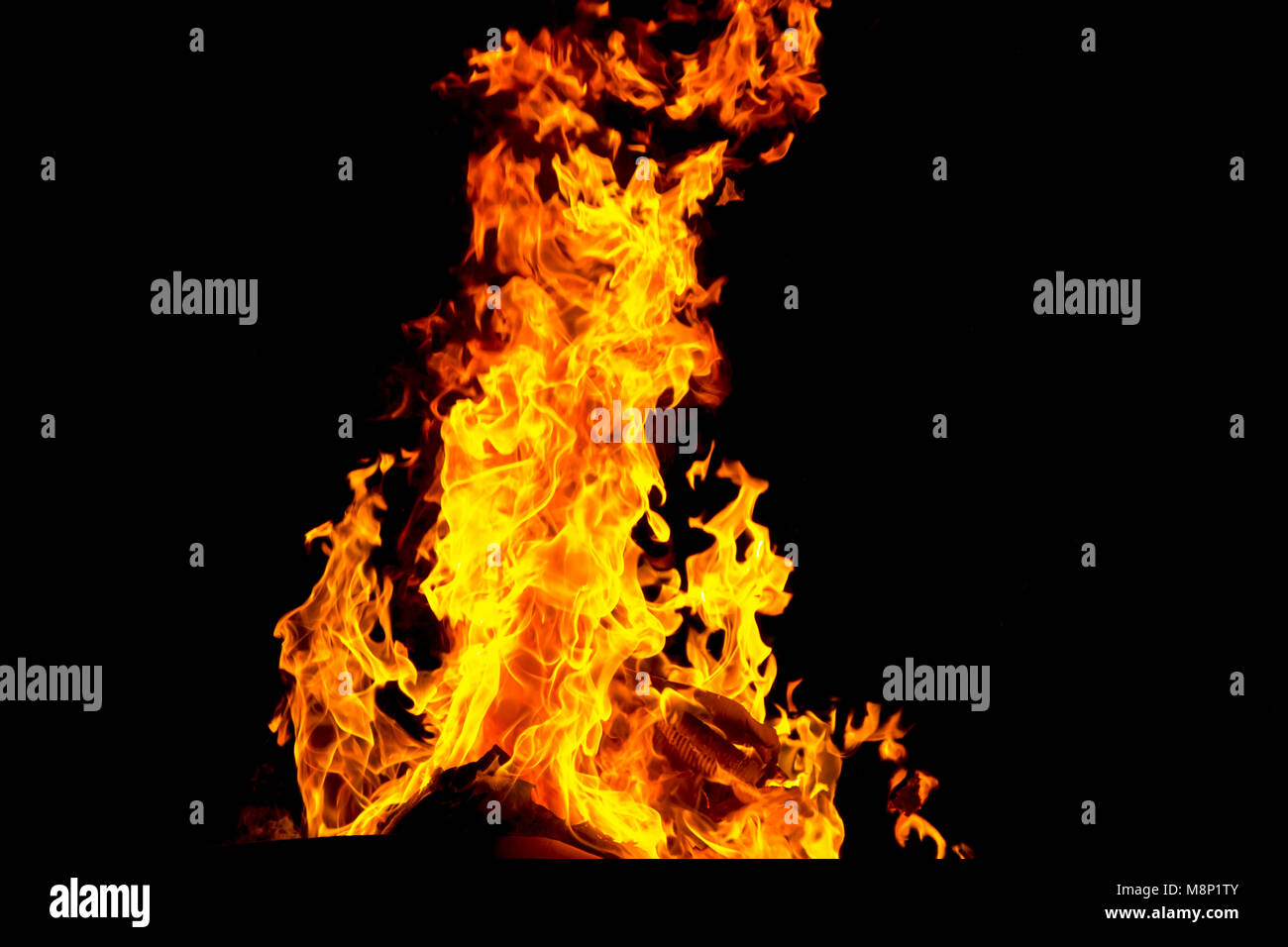 Photo of red fire flame on black background Stock Photo - Alamy