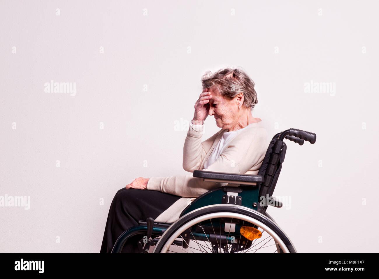 Sad old woman in wheelchair hi-res stock photography and images - Alamy