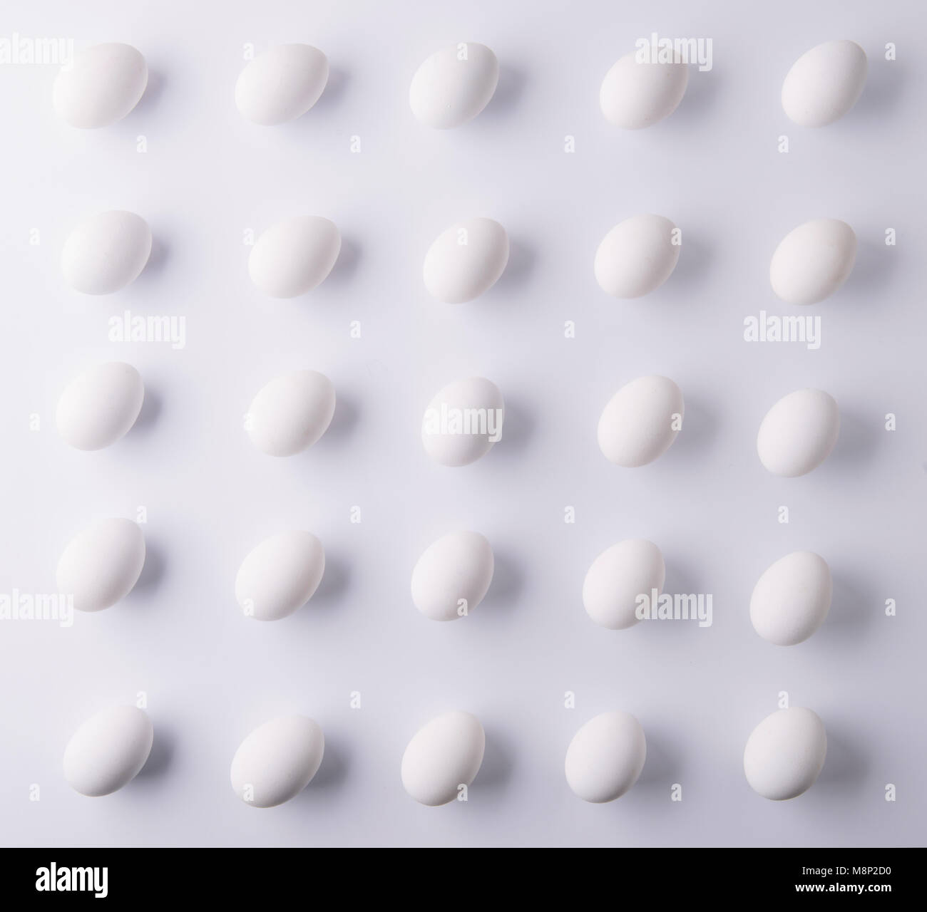White eggs on a white background. Easter and spring flat lay Stock ...