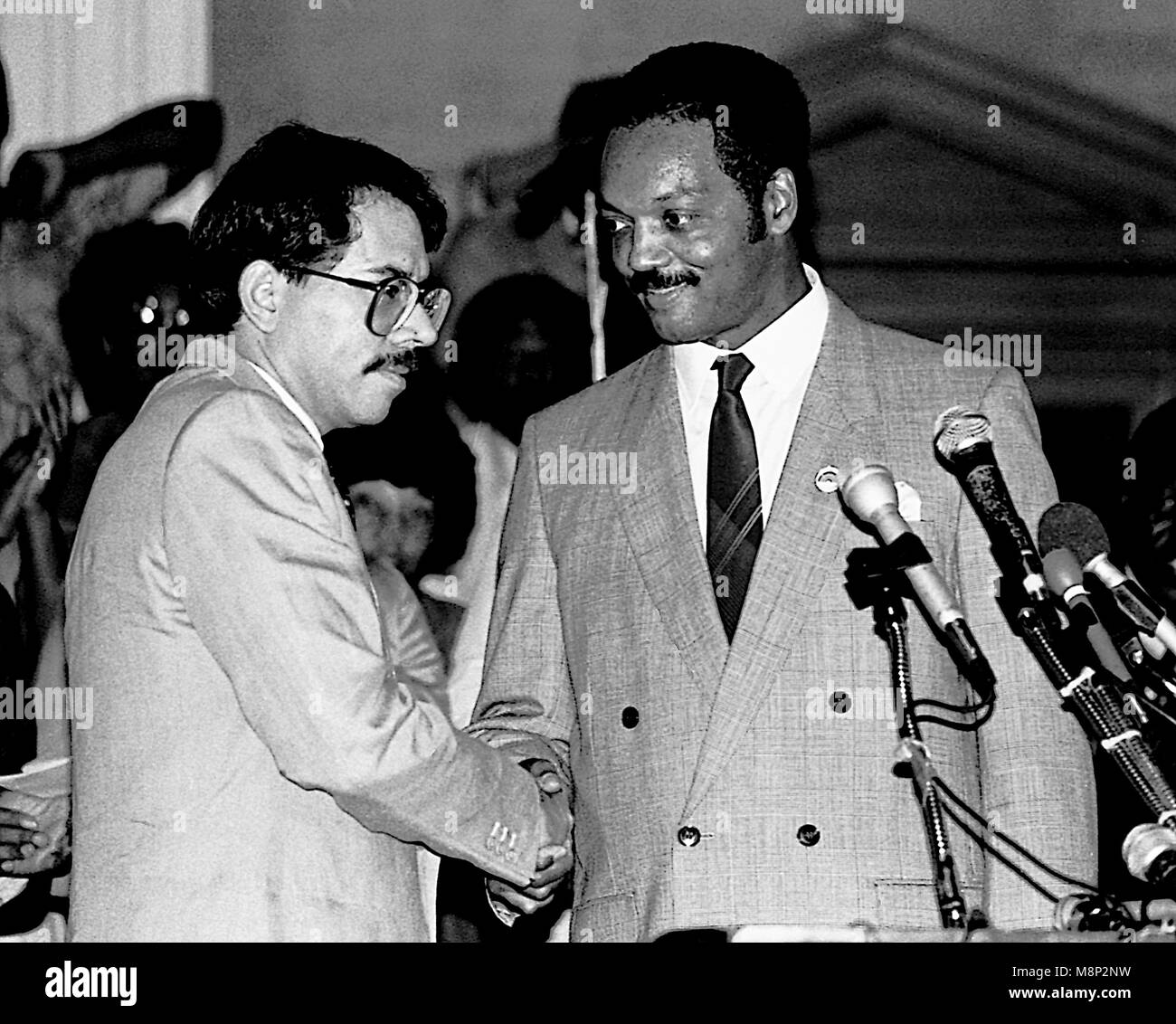 Chicago Illinois, USA, 2nd August, 1986 Nicaraguan President Daniel Ortega shakes hands with the Rev. Jessie Jackson at the headquarters of 'Operation Push'  as part of his visit to the United States. ``Nicaragua is willing to negotiate with the United States toward a treaty of peace and friendship,`` Ortega said through an interpreter. ``We are willing to sign a treaty of peace and friendship with the United States immediately.`` Credit: Mark Reinstein/MediaPunch Stock Photo