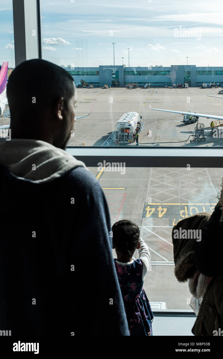 Black afreican family at the airport,Luton,UK Stock Photo