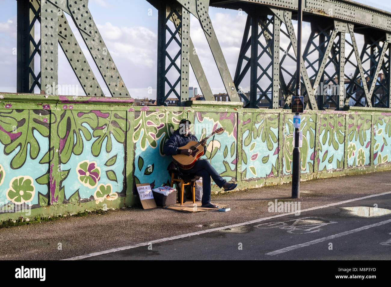 Busker sitting wooden stool hi-res stock photography and images - Alamy