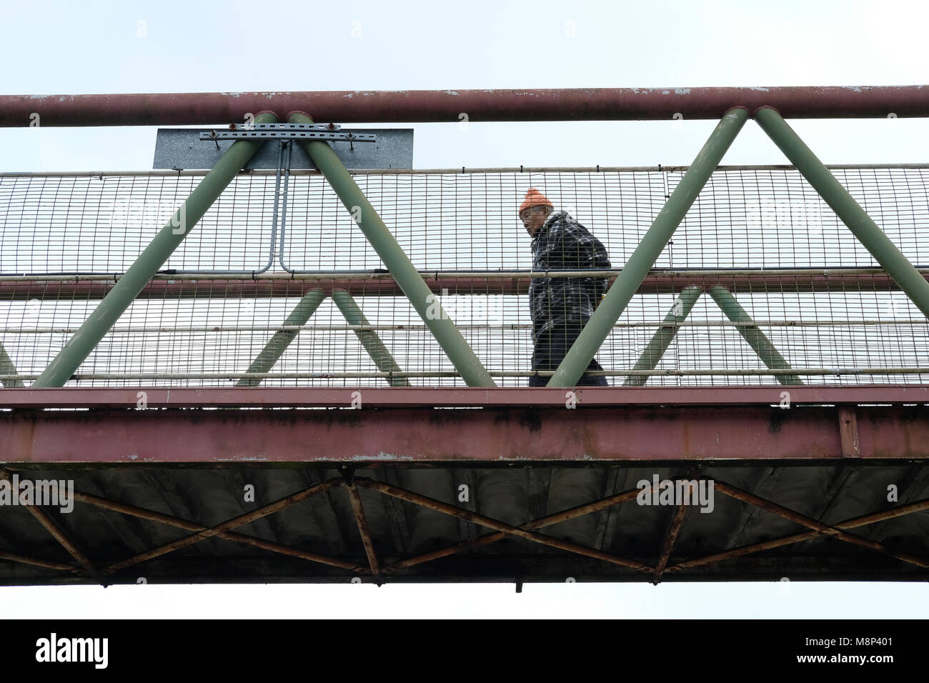 A Nepalese man crosses the railway bridge in Aldershot. Stock Photo
