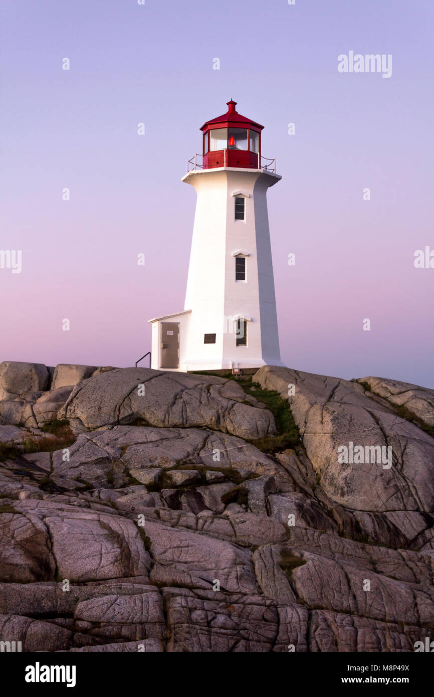 One of world's most photographed lighthouses - Peggy's Cove, Nova Scotia at dawn with no distractions, and no tourists in sight Stock Photo