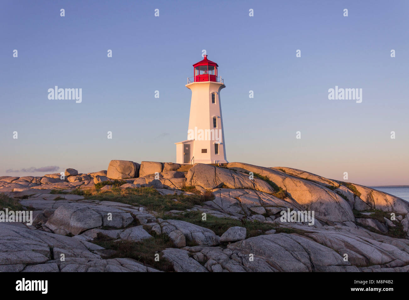 One of world's most photographed lighthouses - Peggy's Cove, Nova Scotia at dawn with no distractions, and no tourists in sight Stock Photo