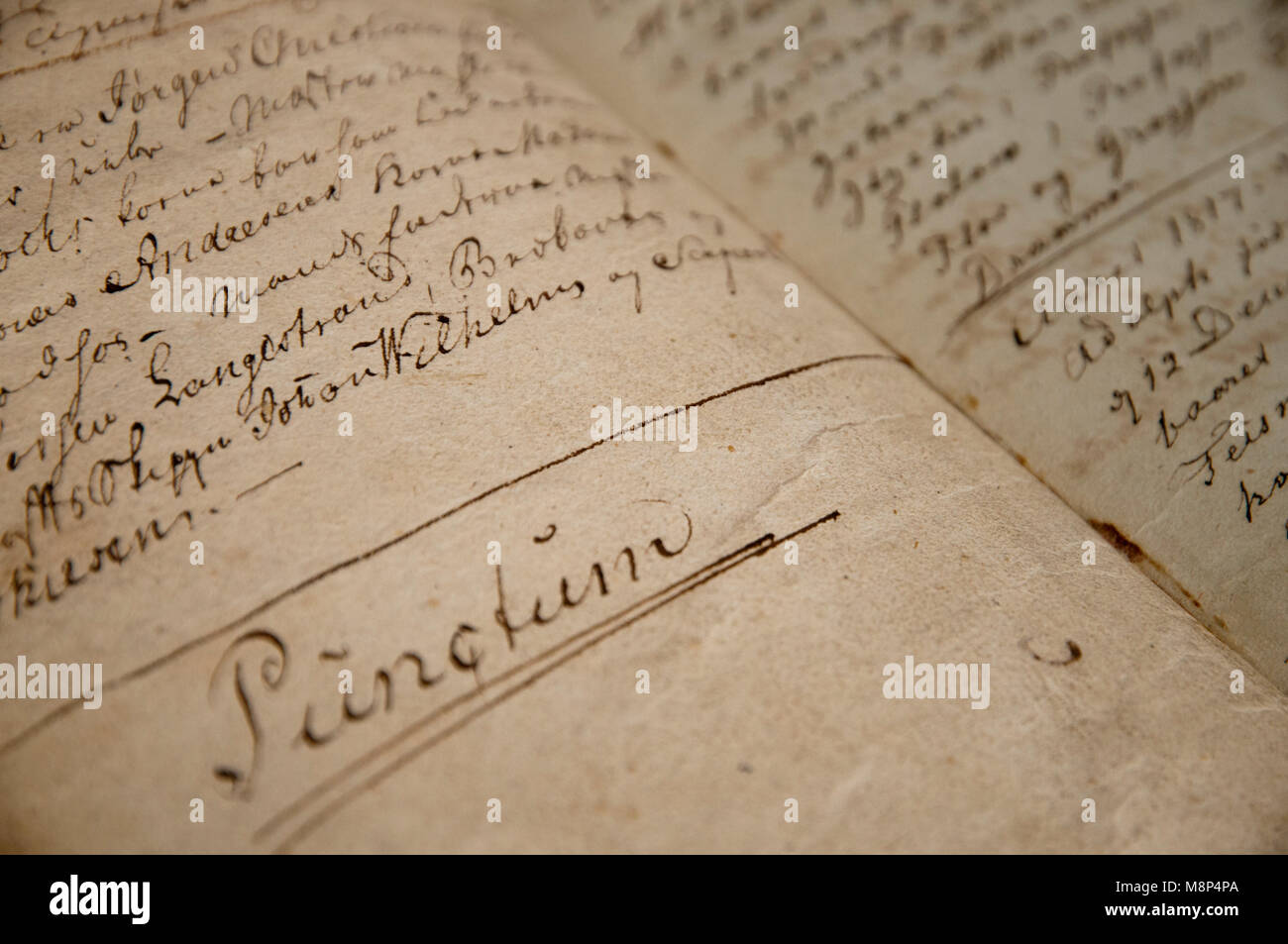 Close up of a bible handed from father to son from the 1760s. Blank pages are gradually filled with hand-written information about family milestones. Stock Photo