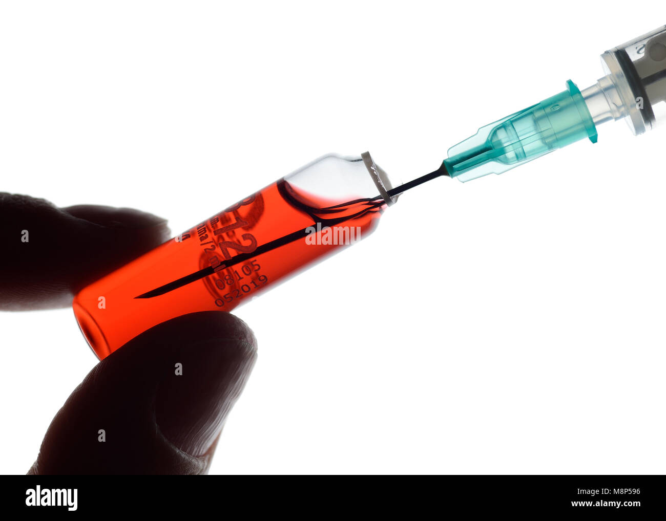 Vial and Syringe, Preparing for an Injection of Hydroxocobalamin, Close Up Stock Photo