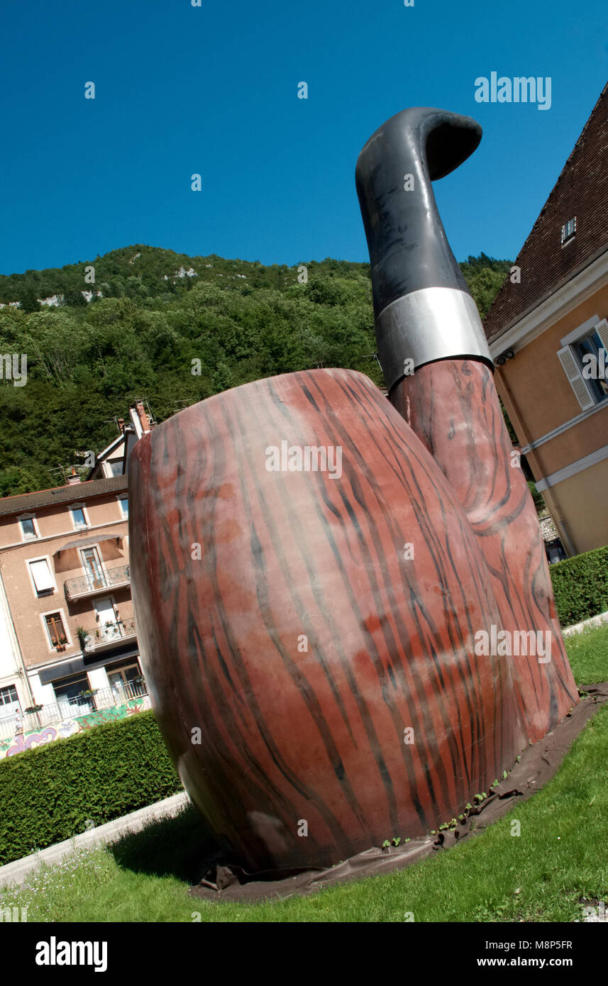 A giant pipe in the town of Sainte-Claude in the Upper Jura regional Nature Park in France. The town is famous for the production of briar pipes. Stock Photo